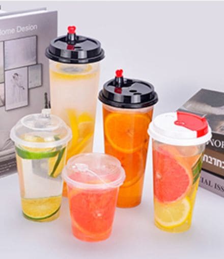 Custom plastic beverage cups with multiple lid options for cold drinks