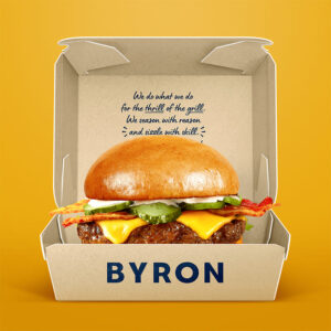 Open kraft burger box with cheeseburger for takeaway food packaging