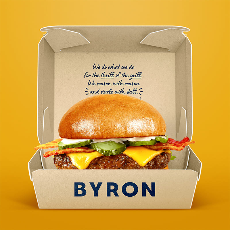 Open kraft burger box with cheeseburger for takeaway food packaging