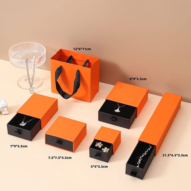 Orange paper jewelry boxes in different sizes for necklaces and earrings
